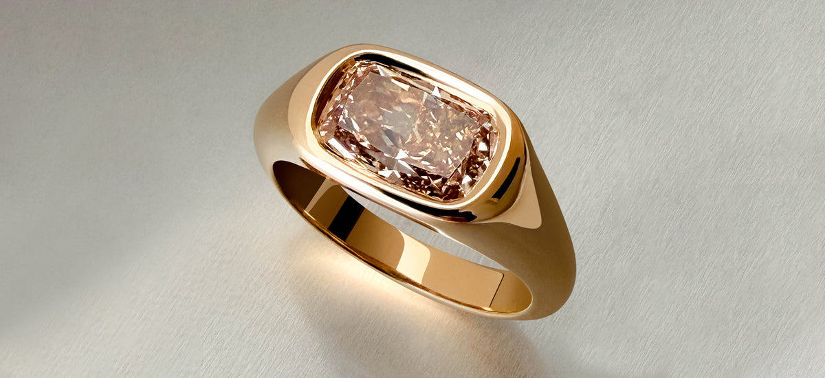 An assortment of stacked Guys Gold rings