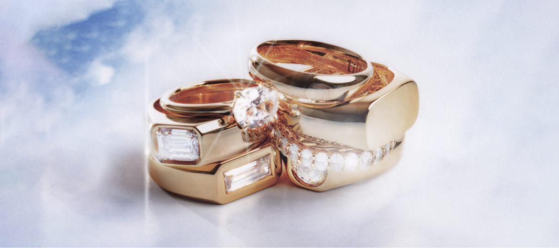 An assortment of stacked Guys Gold rings